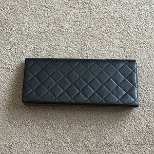 Black quilted clutch bag